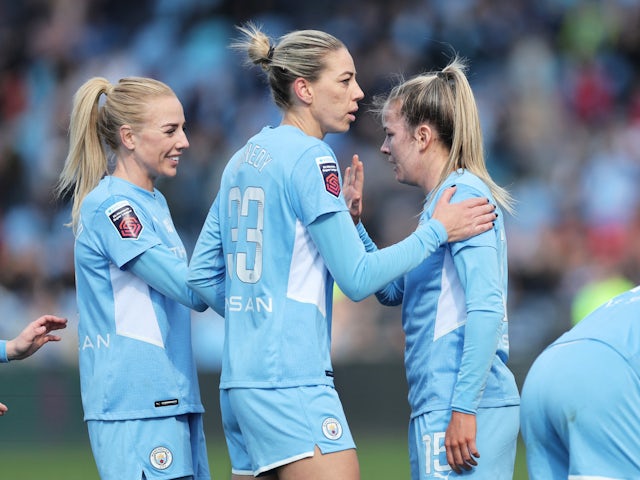 Manchester City Women's Lauren Hemp celebrates scoring their first goal with Alanna Kennedy on March 20, 2022