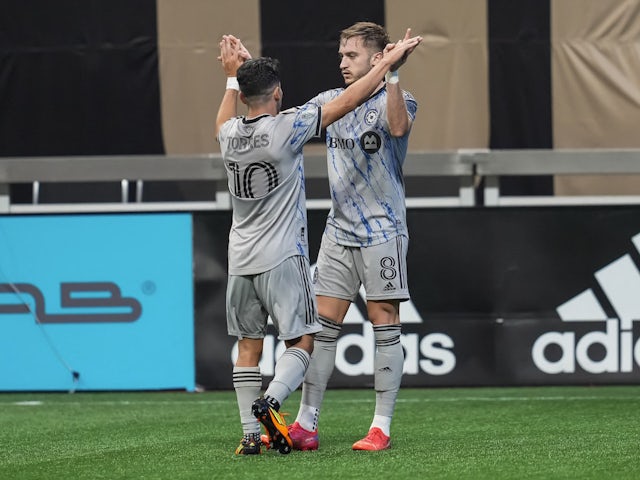 CF Montreal midfielder Djordje Mihailovic (8) reacts with midfielder Joaquin Torres (10) after scoring a goal against Atlanta United during the first half at Mercedes-Benz Stadium on March 19, 2022