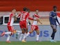 Monaco's Kevin Volland celebrates scoring their second goal with teammates on March 20, 2022