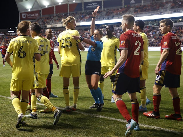 Major League Soccer referee Tori Penso shows the red card to Nashville SC midfielder Dax McCarty (6) in the closing minutes of their game against the Real Salt Lake at Rio Tinto Stadium on March 19, 2022
