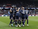 Paris Saint-Germain's (PSG) Kylian Mbappe celebrates scoring their first goal with teammates on March 12, 2022