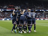 Paris Saint-Germain's (PSG) Kylian Mbappe celebrates scoring their first goal with teammates on March 12, 2022
