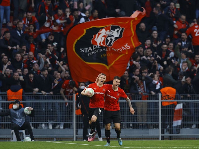 Rennes' Benjamin Bourigeaud celebrates scoring their first goal with Baptiste Santamaria on March 17, 2022