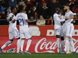Real Madrid's Vinicius Junior celebrates scoring their first goal with Ferland Mendy and Karim Benzema on March 14, 2022