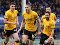 Wolverhampton Wanderers' Conor Coady celebrates scoring their first goal Joao Moutinho, Max Kilman and Romain Saiss on March 13, 2022