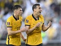 Australia's Ajdin Hrustic and Trent Sainsbury react on March 24, 2022