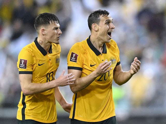Australia's Ajdin Hrustic and Trent Sainsbury react on March 24, 2022