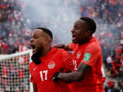 Canada's Cyle Larin celebrates scoring their first goal on March 27, 2022