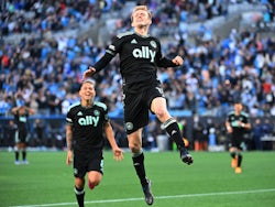 Charlotte FC forward Karol Swiderski (11) celebrates with midfielder Jordy Alcivar (8) after scoring a goal in the second half at Bank of America Stadium on March 26, 2022