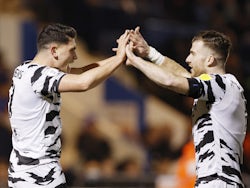 Forest Green Rovers' Mathew Stevens celebrates scoring their first goal with teammate on March 21, 2022