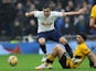 Tottenham Hotspur's Harry Winks in action with Wolverhampton Wanderers' Raul Jimenez on February 13, 2022