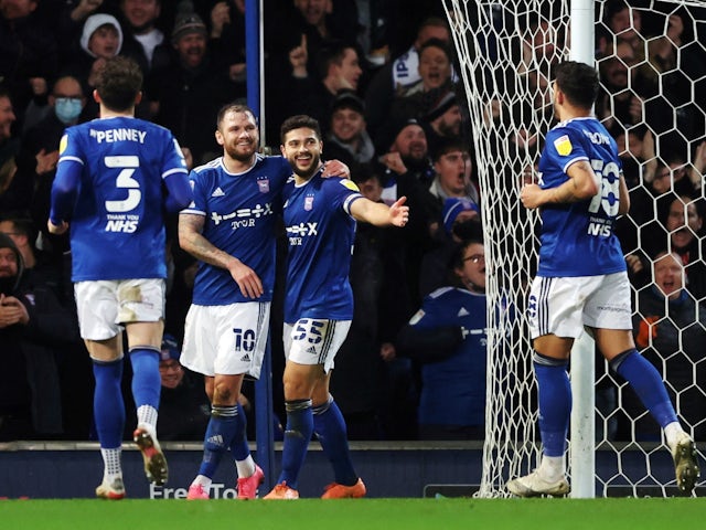 Ipswich Town's James Norwood celebrates scoring their first goal with teammates on December 29, 2021 