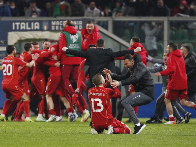 North Macedonia's Stefan Ristovski celebrates with teammates after the match on March 24, 2022