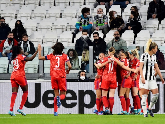 Lyon Women's Catarina Macario celebrates scoring their first goal with teammates on March 22, 2022