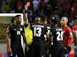 Canada's Mark-Anthony Kaye is shown a red card by referee Said Martinez on March 25, 2022