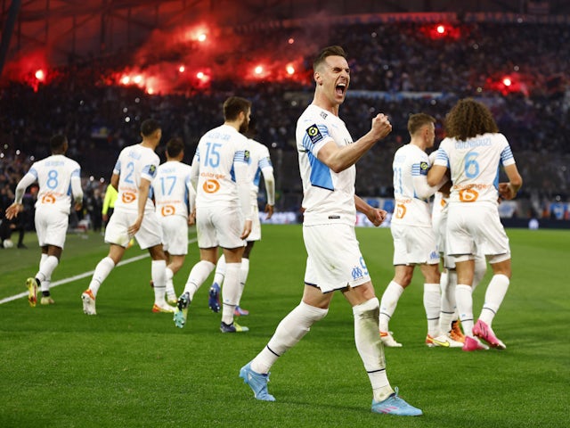 Marseille's Arkadiusz Milik celebrates scoring their first goal with teammates on March 20, 2022