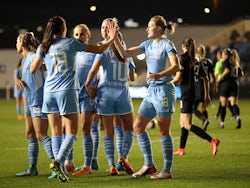 Manchester City Women players celebrate after Everton's Simone Magill scored an own goal and their first goal on March 23, 2022