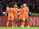 Netherlands' Steven Bergwijn celebrates scoring their first goal with teammates on March 26, 2022