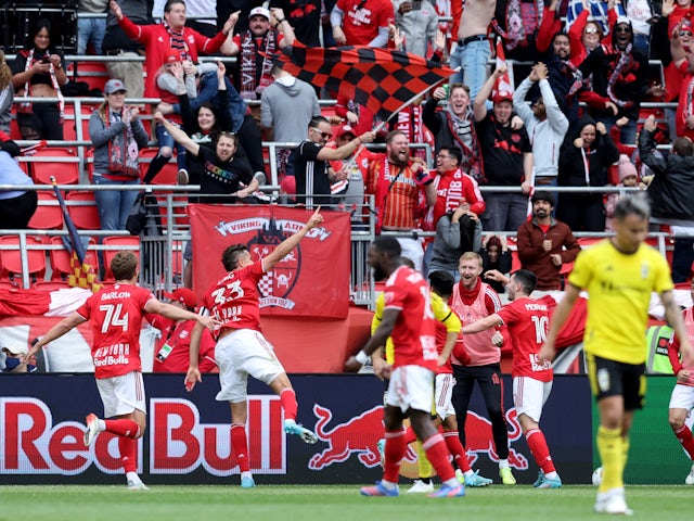 New York Red Bulls midfielder Aaron Long (33) celebrates a goal against the Columbus Crew with teammates during the second half at Red Bull Arena on March 20, 2022