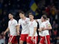 Poland's Krzysztof Piatek celebrates scoring their first goal with teammates on March 24, 2022