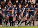 Paris Saint Germain Women's Marie-Antoinette Katoto celebrates scoring their first goal with teammates on March 22, 2022