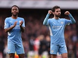 Manchester City's Raheem Sterling and Bernardo Silva celebrate after the match on January 1, 2022