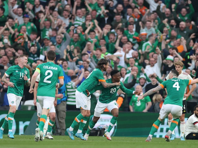 Republic of Ireland's Chiedozie Ogbene celebrates scoring their first goal with teammates on March 26, 2022