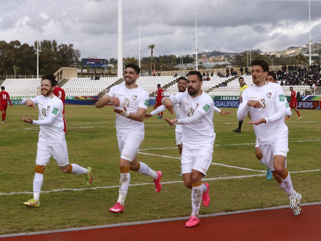 Syria's Mardik Mardikian celebrates scoring their second goal with teammates on March 24, 2022