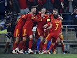 Wales' Gareth Bale celebrates scoring their first goal with teammates on March 24, 2022