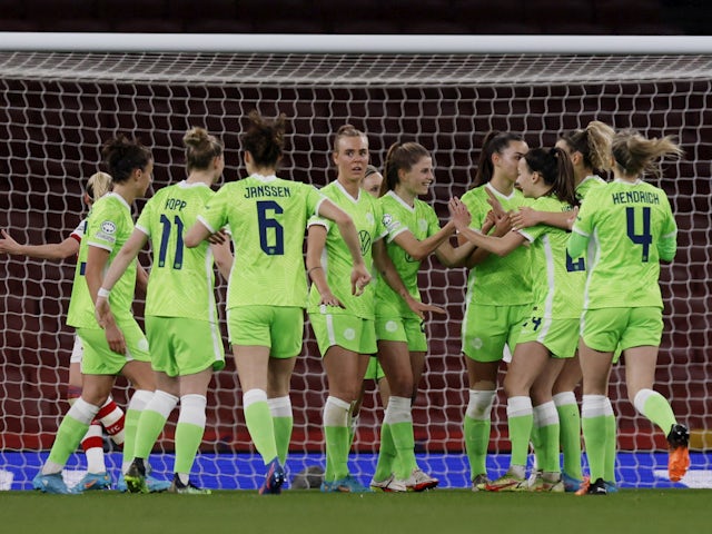 Wolfsburg Women's Tabea Wassmuth celebrates scoring their first goal with teammates on March 23, 2022