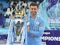 Manchester City's Aymeric Laporte poses with the Premier League trophy on May 23, 2021 
