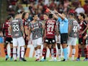 Fluminense's Fred and Flamengo's Bruno Henrique are shown a red card by referee Bruno Arleu on April 2, 2022
