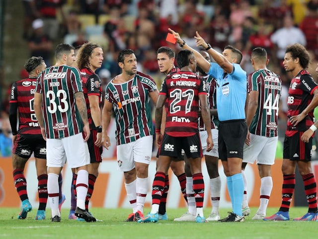 Fluminense's Fred and Flamengo's Bruno Henrique are shown a red card by referee Bruno Arleu on April 2, 2022
