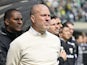 Portland Timbers head coach Giovanni Savarese stands during the singing of the national anthem before a game against Orlando City at Providence Park on March 27, 2022