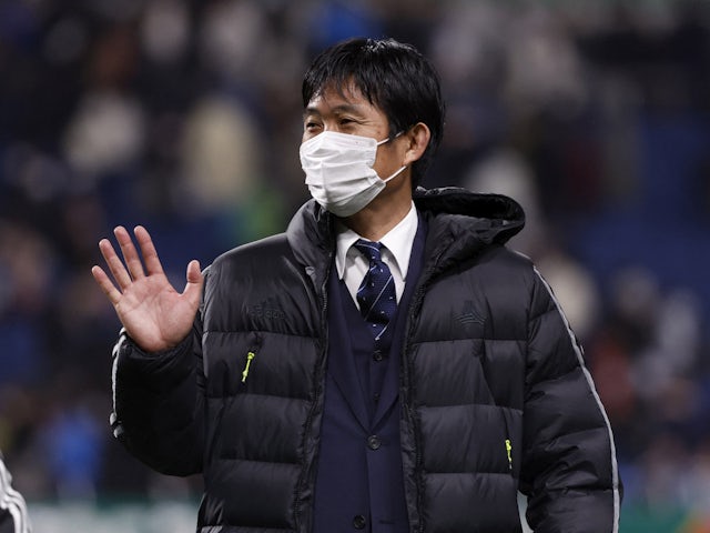 Japan coach Hajime Moriyasu waves to fans after the match during a ceremony for qualifying for the world cup on March 29, 2022