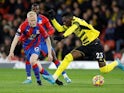 Crystal Palace's Will Hughes in action with Watford's Ismaila Sarr on February 23, 2022