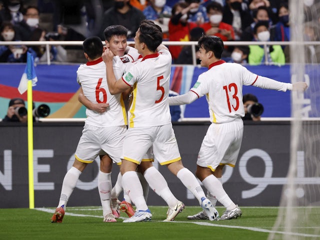 Vietnam's Nguyen Binh Thanh celebrates scoring their first goal with teammates on March 29, 2022