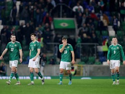 Northern Ireland's Ciaron Brown, Paddy McNair, Dion Charles and Shayne Lavery react after the match on March 29, 2022