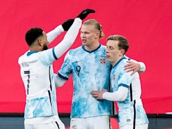 Norway's Erling Braut Haaland celebrates scoring their first goal with teammates on March 29, 2022
