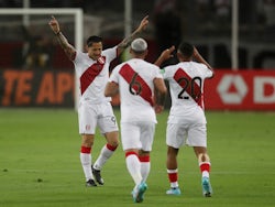 Peru's Gianluca Lapadula celebrates scoring their first goal with teammates on March 30, 2022
