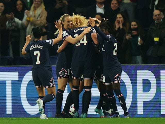 Paris Saint-Germain Women's Sandy Baltimore celebrates scoring their first goal with teammates on March 30, 2022
