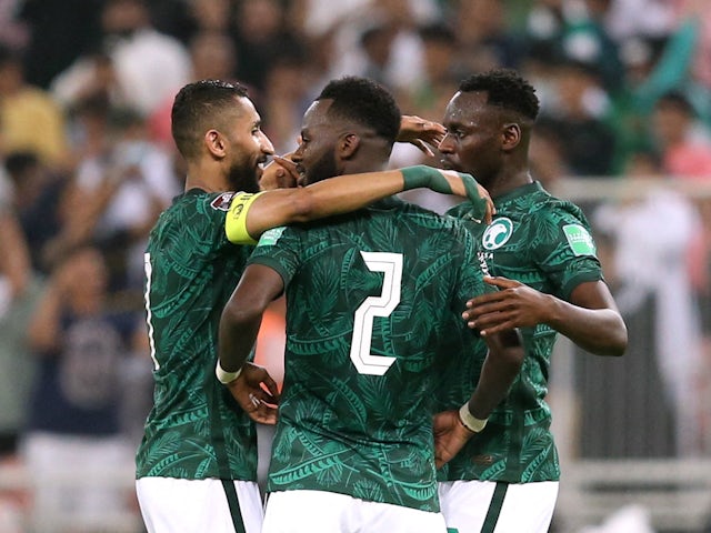 Saudi Arabia's Hassan Al Tambakti celebrates with teammates after the match on March 29, 2022
