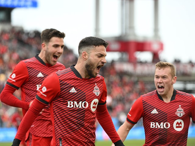 Toronto FC forward Jesus Jimenez (9) celebrates with midfielders Luca Petrasso (38, left) and Jacob Shaffelburg (22) after scoring against New York City FC in the first half at BMO Field on April 2, 2022