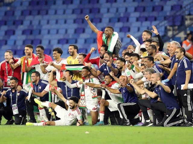 United Arab Emirates players and staff celebrate after the match on March 29, 2022