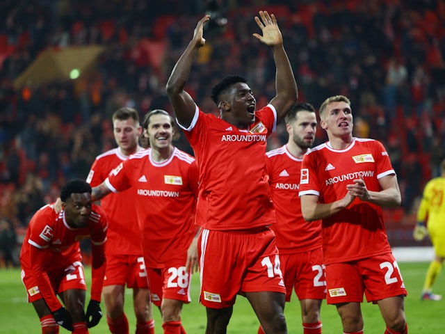 Union Berlin's Taiwo Awoniyi celebrates scoring their first goal with teammates on April 1, 2022