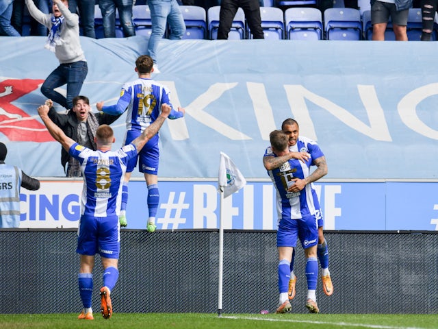 Wigan Athletic players celebrate James McLean's first goal on 2 April 2022