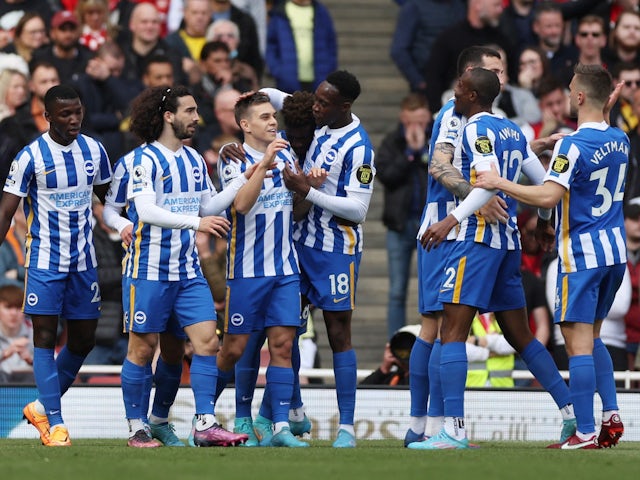 Brighton & Hove Albion's Leandro Trossard celebrates with his teammates after scoring his first goal on 9 April 2022
