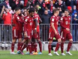 Bayern Munich's Robert Lewandowski celebrates scoring their first goal with teammates on April 9, 2022