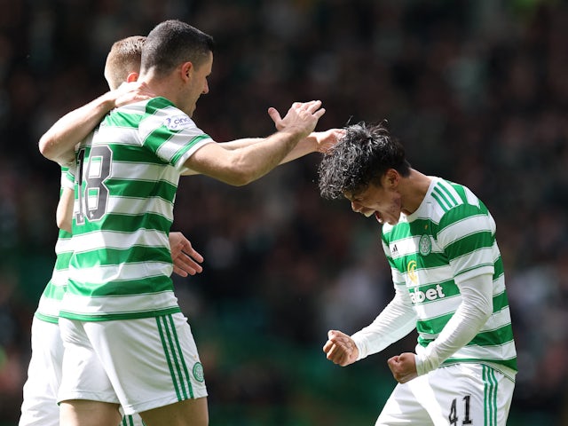 Celtic's Reo Hatate celebrates scoring their first goal with teammates on April 9, 2022