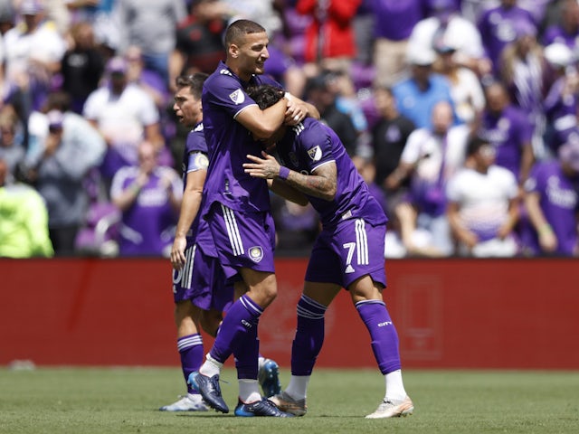 Orlando City forward Ercan Kara (9) celebrates with Orlando City forward Alexandre Pato (7) after an assist goal in the second half against the Chicago Fire at Orlando City Stadium on April 9, 2022